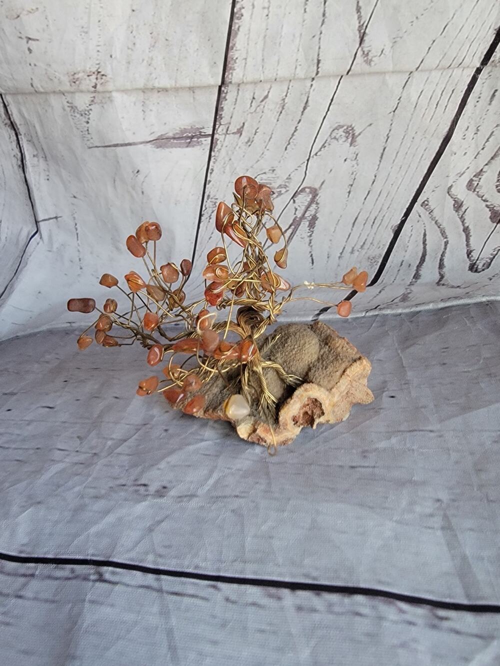 Crystal Tree of Life sculpture featuring a gold-colored wire trunk Stone Base